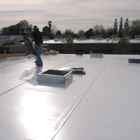 TPO roofing being installed on building